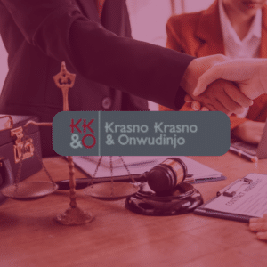 Two people shaking hands over legal documents with scales of justice and a gavel on the table, symbolizing the expertise of Krasno Krasno & Onwudinjo in Social Security Disability cases, providing professional legal support for clients seeking disability benefits